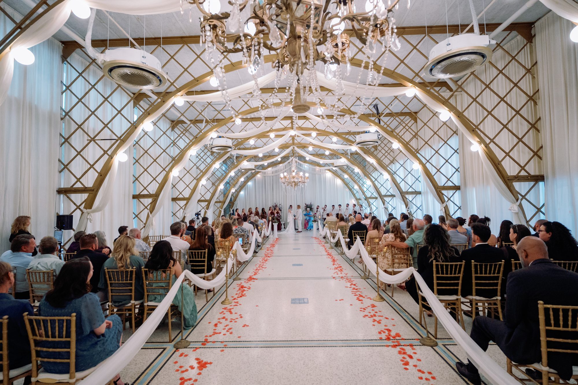 Wide view of the ceremony aisle as the bride walks in