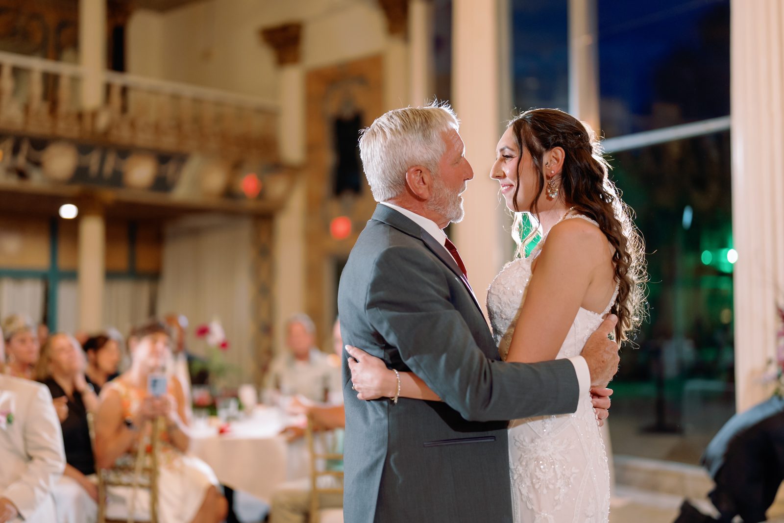 A father and daughter dance during the reception